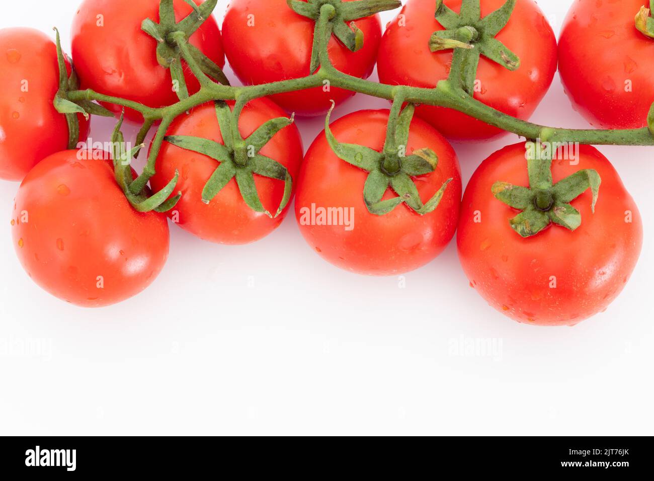 Fresh vegetable, red cherry tomato isolated on white background, food concept, copy space. Stock Photo
