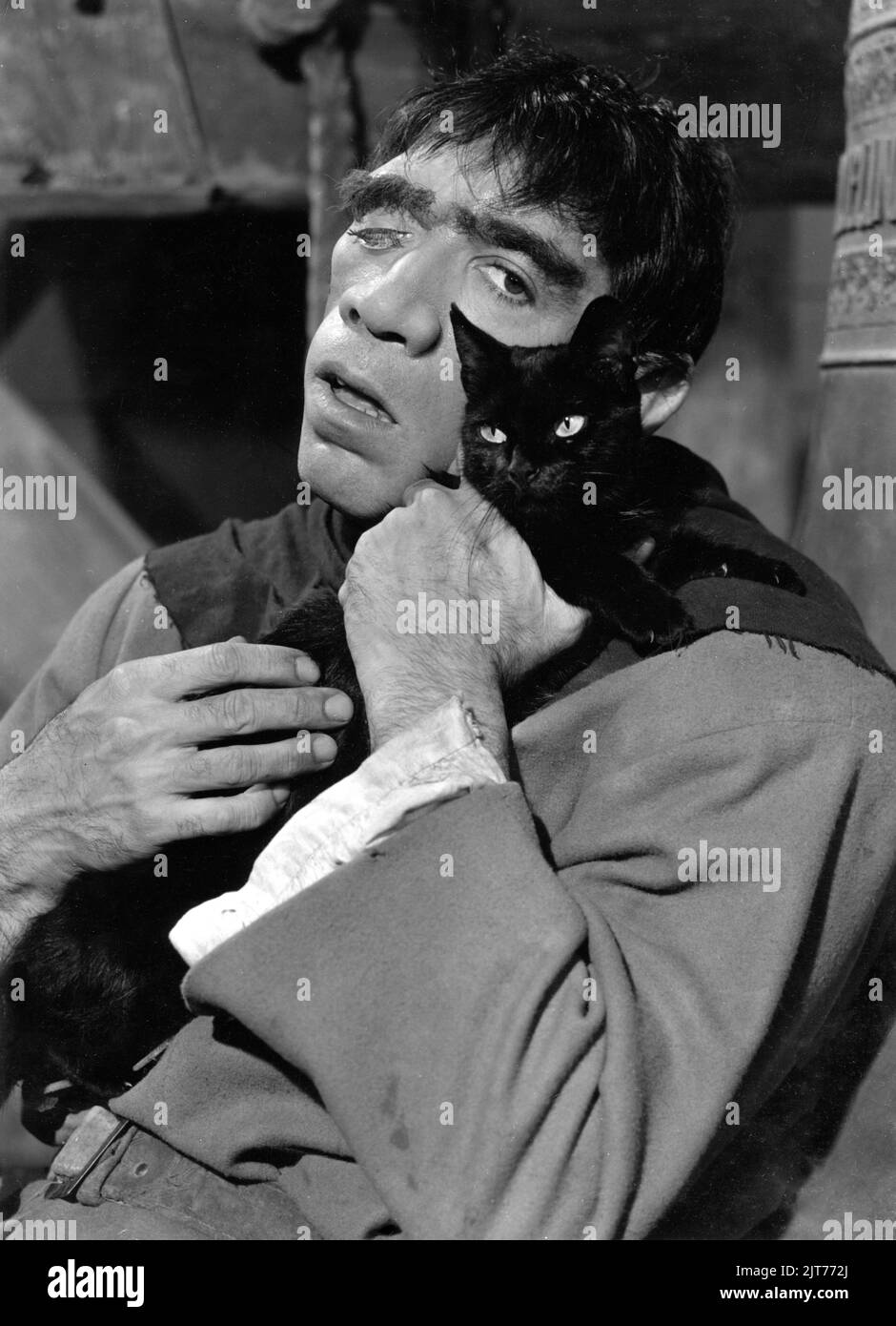 ANTHONY QUINN Portrait As Quasimodo Holding A Black Cat In THE anthony-quinn-portrait-as-quasimodo-holding-a-black-cat-in-the