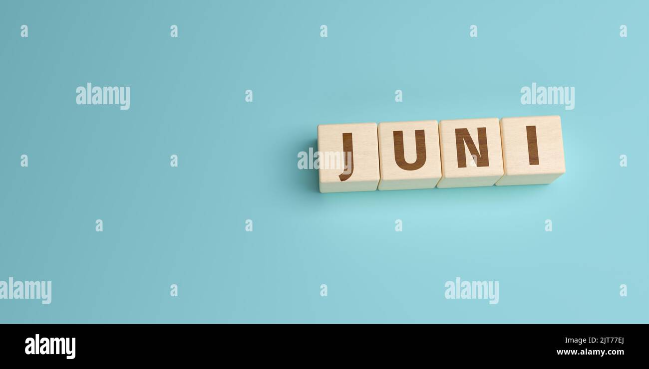 The German word Juni (June) built from letters on wooden cubes. High angle view with copy space Stock Photo