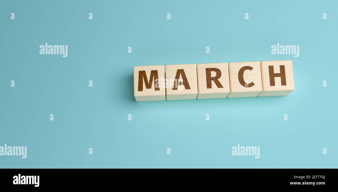 The word March built from letters on wooden cubes. High angle view with copy space Stock Photo