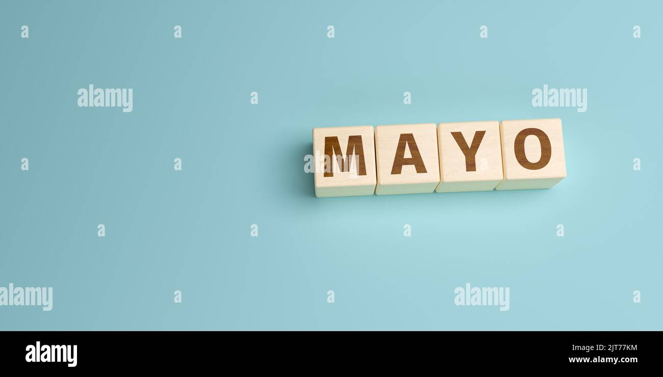 The Spanish word Mayo (May) built from letters on wooden cubes. High angle view with copy space