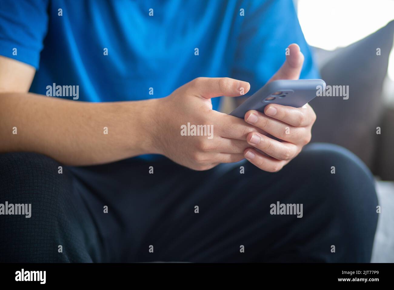 Young man using smart phone Stock Photo