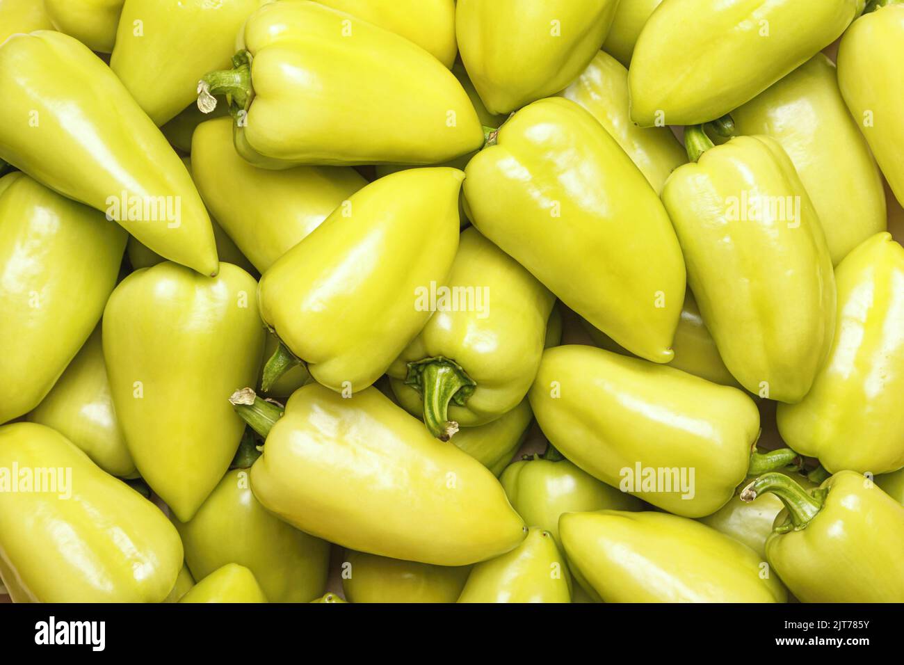 Lots of fresh fruits of green bell peppers. Food background Stock Photo
