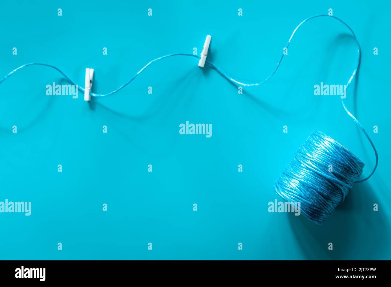 A ball of blue threads on a blue background, flat lay Stock Photo - Alamy