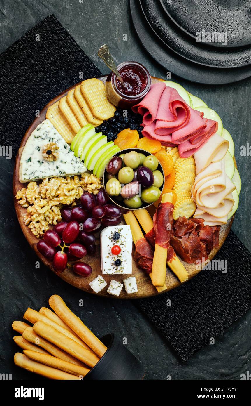The perfect cheese platter with varieties of delicious fresh fruits