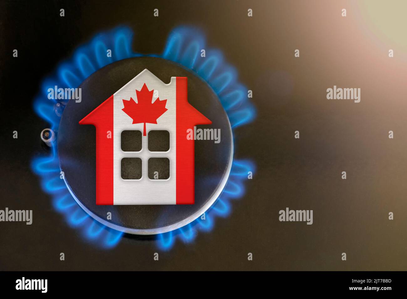 gas crisis. Rising utility costs in Canada. Energy crisis, export-import problems in Canada. The concept, gas burner and house model are colored in Stock Photo