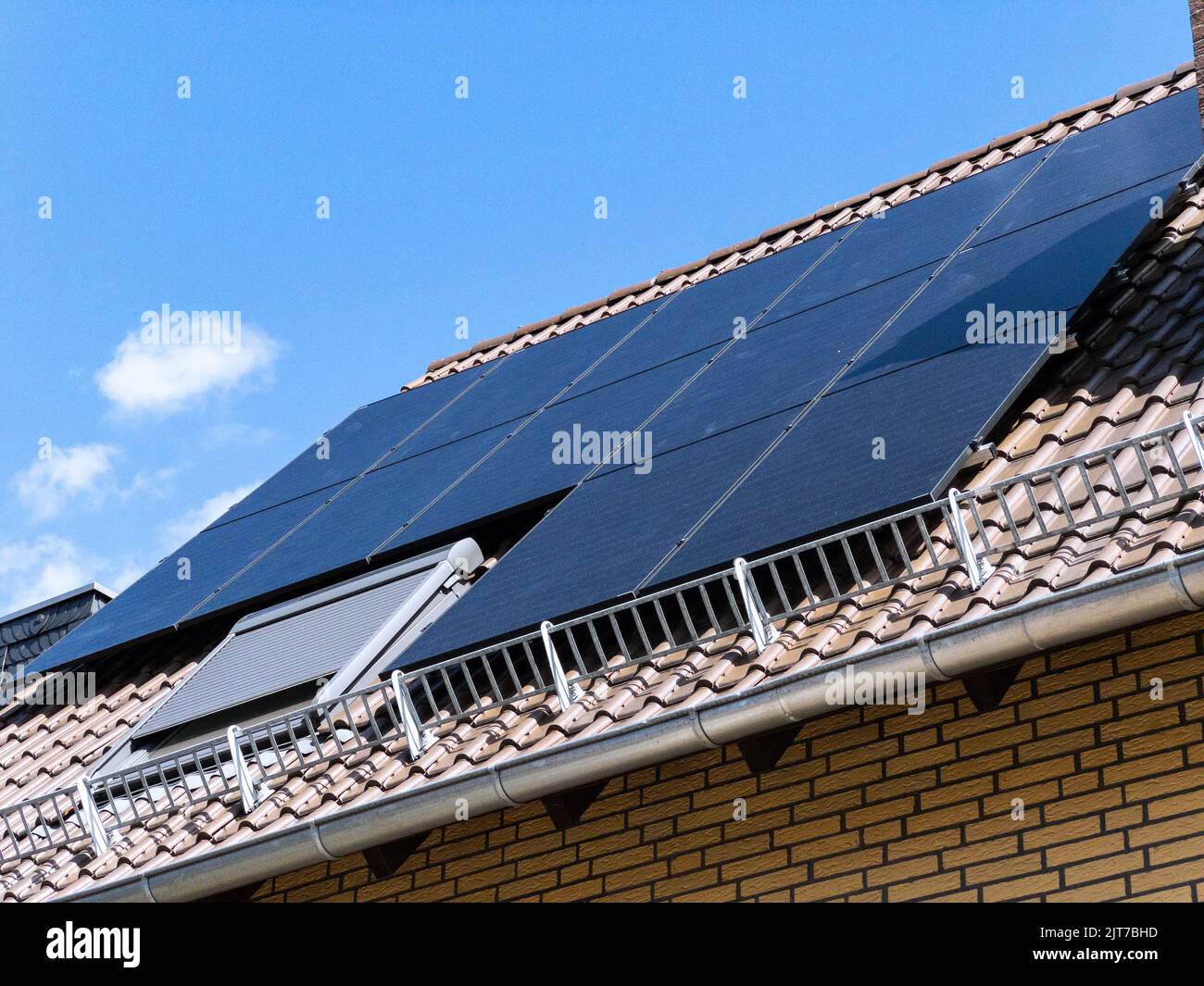 Photovoltaics installed on a residential building - Self-sufficient energy supply from solar energy Stock Photo
