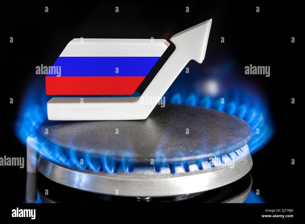 Gas price. Rising prices for Russian gas. A burner with a flame and an up arrow painted in the colors of the Russian flag. The concept of rising gas Stock Photo