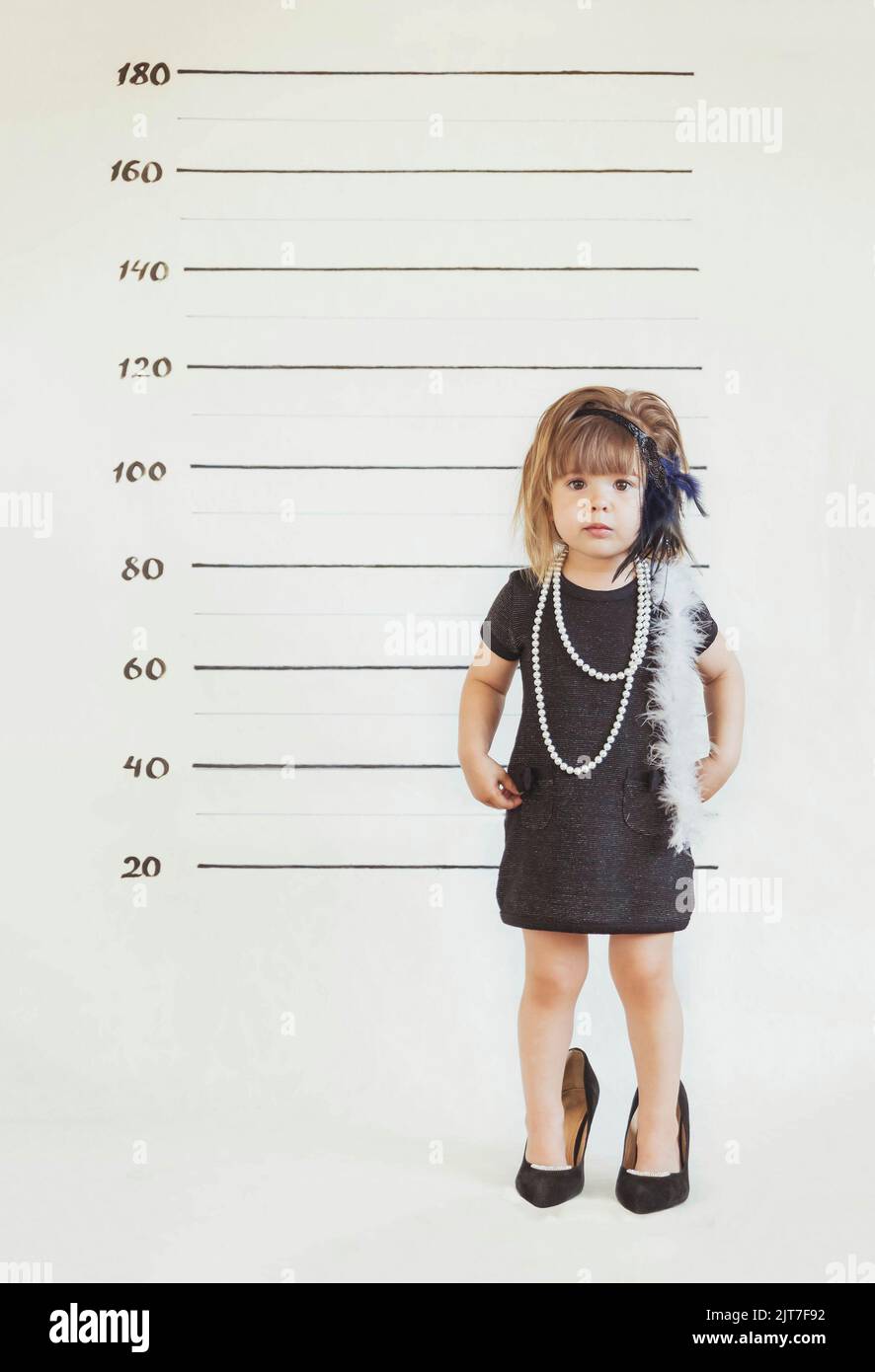 https://c8.alamy.com/comp/2JT7F92/charming-baby-in-gangster-costume-at-the-police-station-2JT7F92.jpg