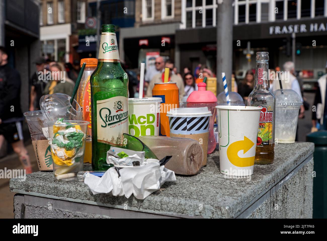 Overflowing litter bins on Princes Street due to industrial action by Edinburgh council workers. Stock Photo
