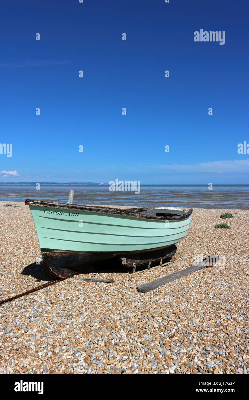 Carole Ann green fishing boat on the shingle beach at Dungeness Kent UK Stock Photo