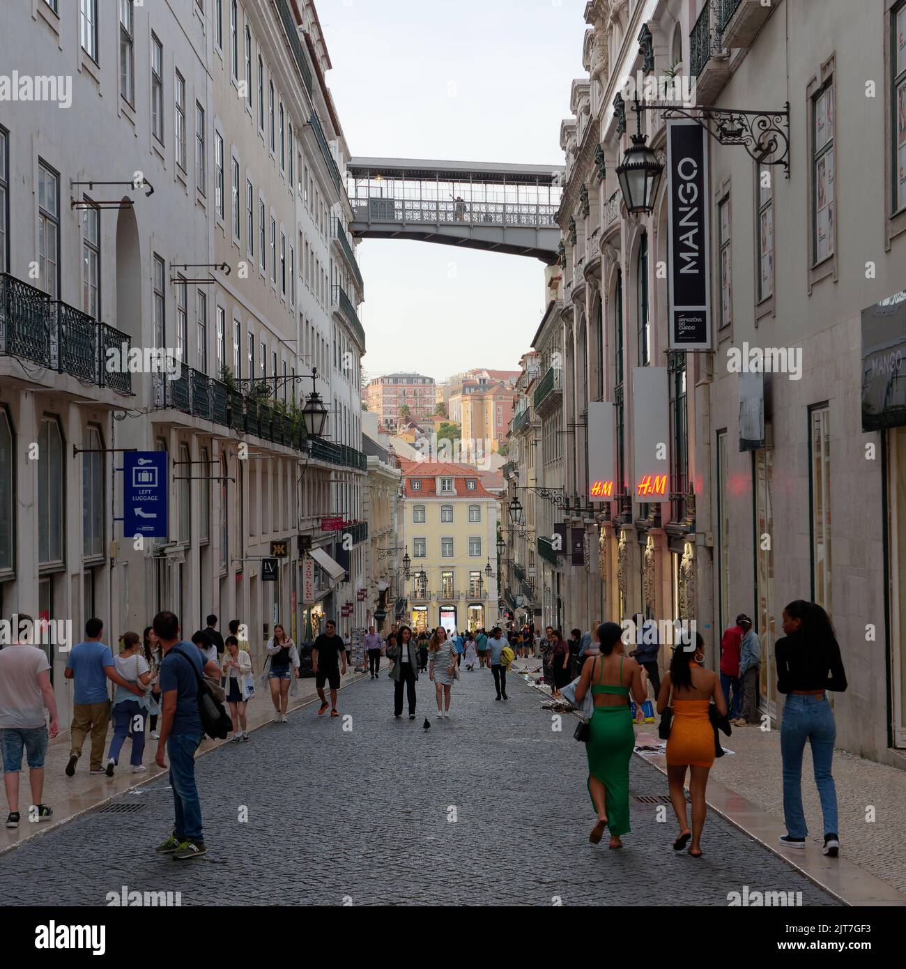 Lisbon street with the walkway to the Santa Justa lift above, Portugal Stock Photo