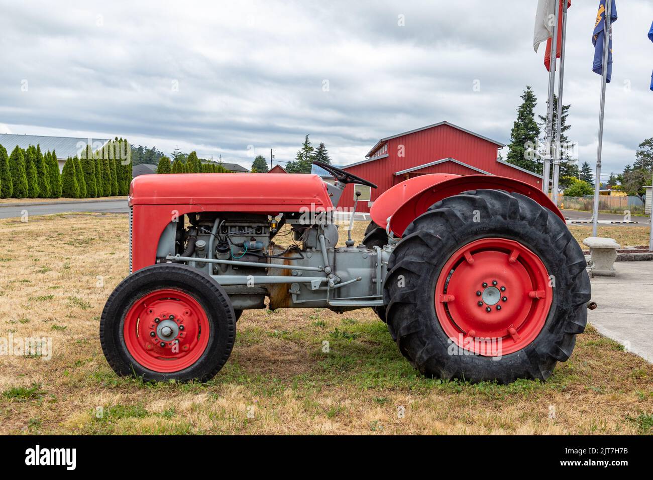 Sequim, WA USA 07182022 Red Farm Tractor in front of Sequim Museum