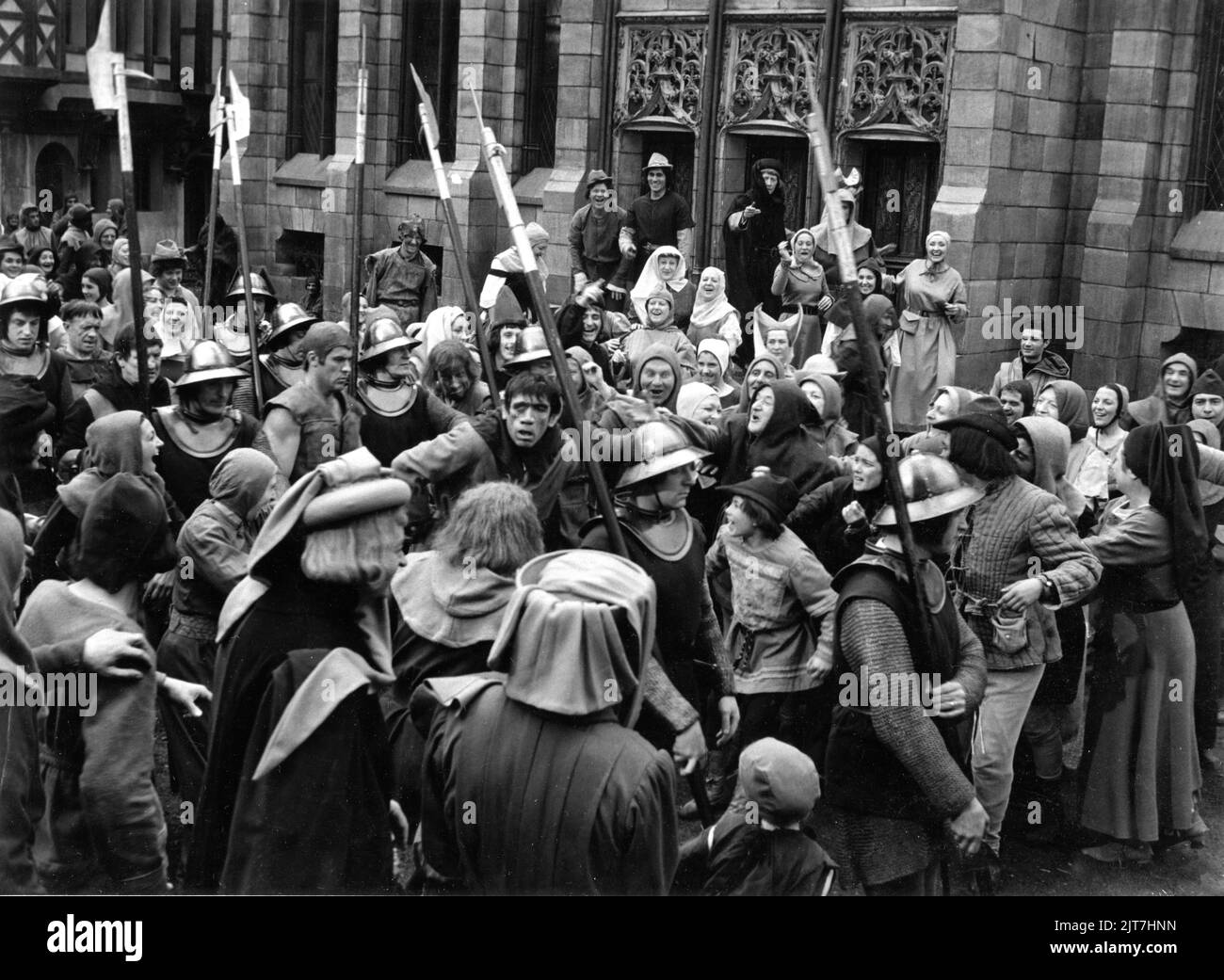 ANTHONY QUINN as Quasimodo taking through jeering crowd to be flogged in THE HUNCHBACK OF NOTRE DAME / NOTRE DAME DE PARIS 1956 director JEAN DELANNOY novel Victor Hugo adaptation / dialogue Jean Aurenche and Jacques Prevert music Georges Auric costume design Georges Benda production design Rene Renoux choreographer Leonid Massine producers Raymond and Robert Hakim France - Italy co-production Paris Film Productions / Panitalia Stock Photo