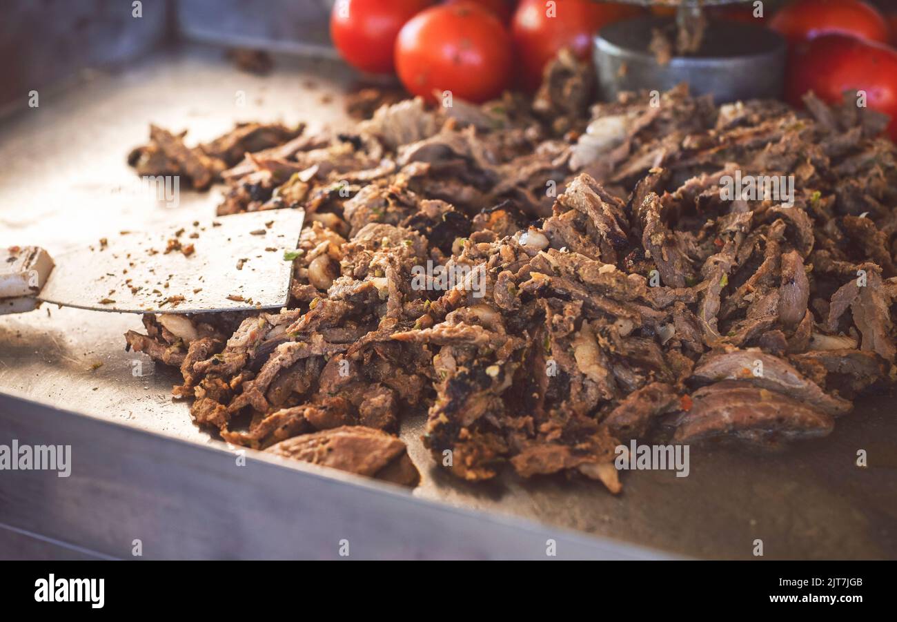 Arabic Cuisine; Delicious thin cuts of seasoned meat. Close up for