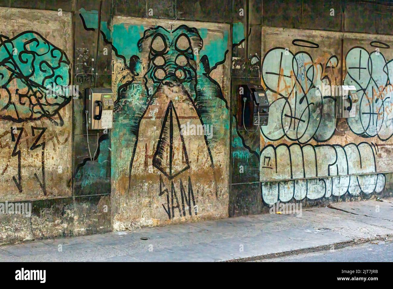 Urban graffiti in a city dirty wall Stock Photo