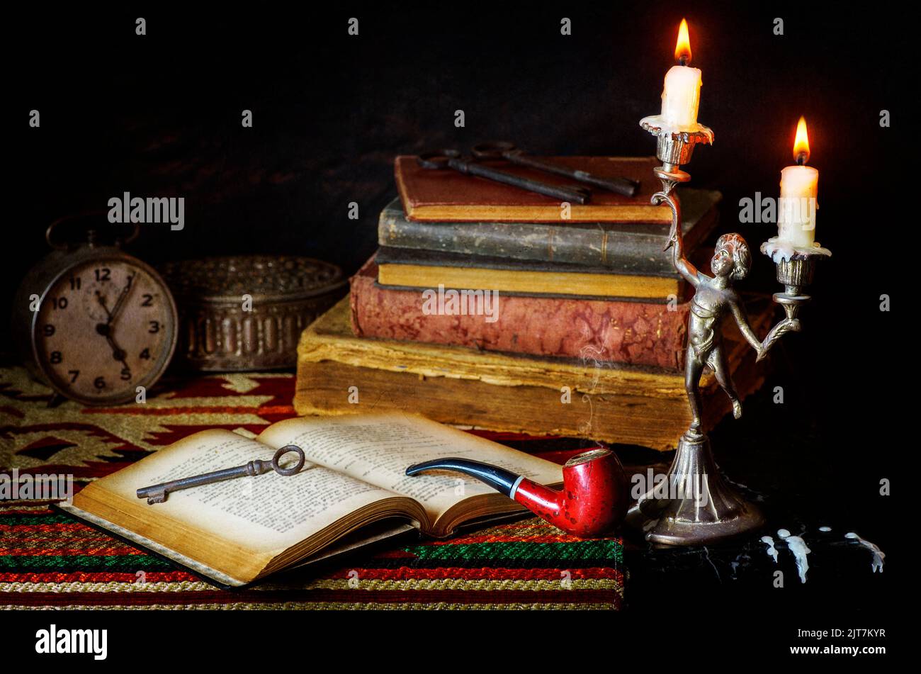 Classic still life with vintage books placed with old clock, antique