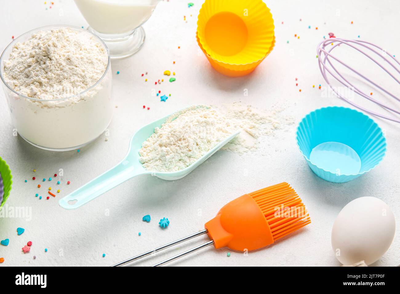 Composition with ingredients for baking pastry and utensils on light