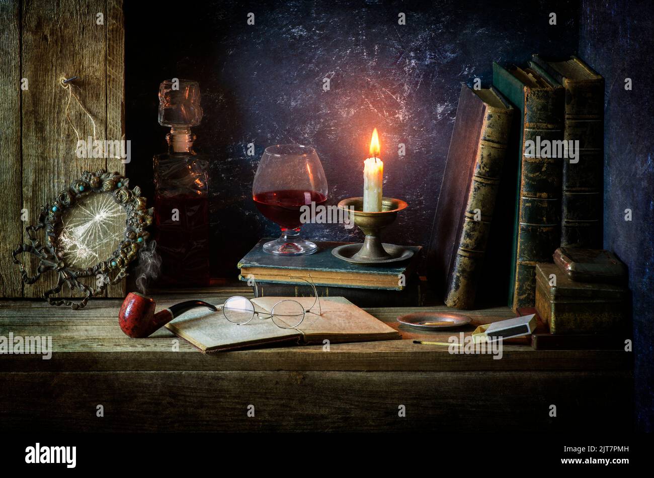 https://c8.alamy.com/comp/2JT7PMH/classic-still-life-with-vintage-books-placed-with-old-boxes-broken-frame-pipe-antique-glasses-illuminated-candle-bottle-and-glass-of-red-wine-2JT7PMH.jpg
