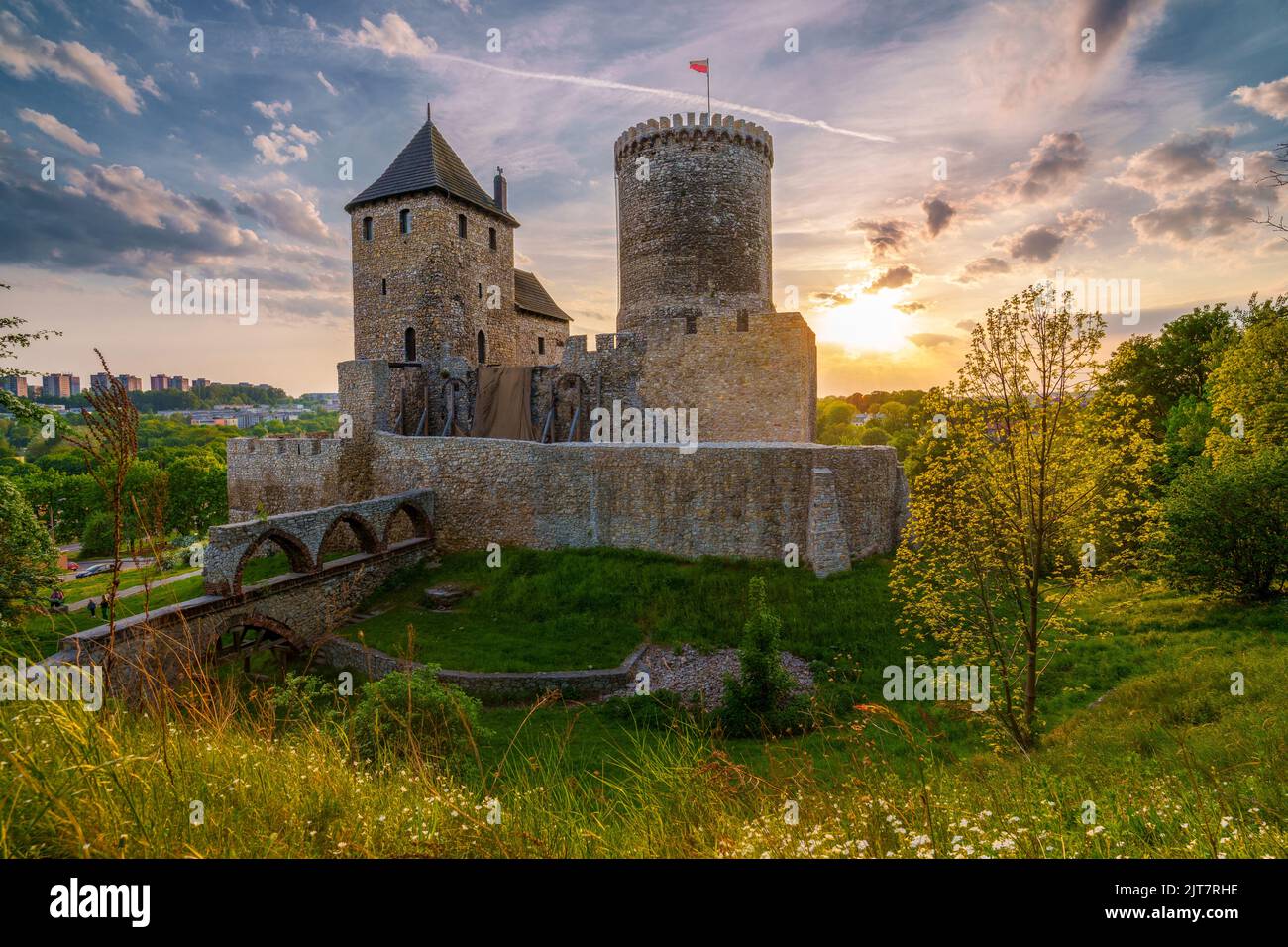 The Piast dynasty stone Castle in Bedzin, Silesian Voivodeship, Poland. Building from the 14th century, medieval. Good weather, coluds and  sunset. Stock Photo