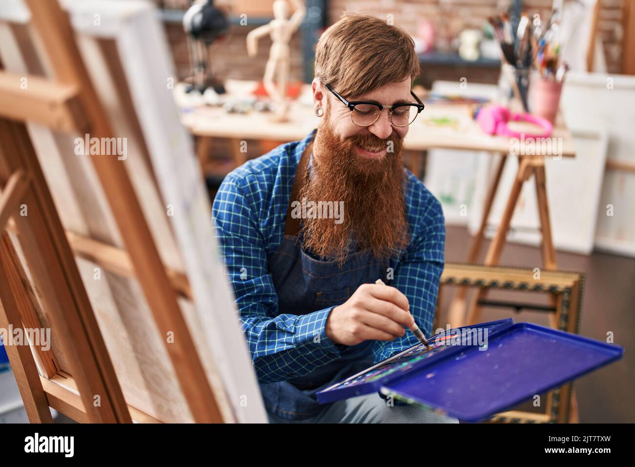 Smiling redhead man painting hi-res stock photography and images - Alamy