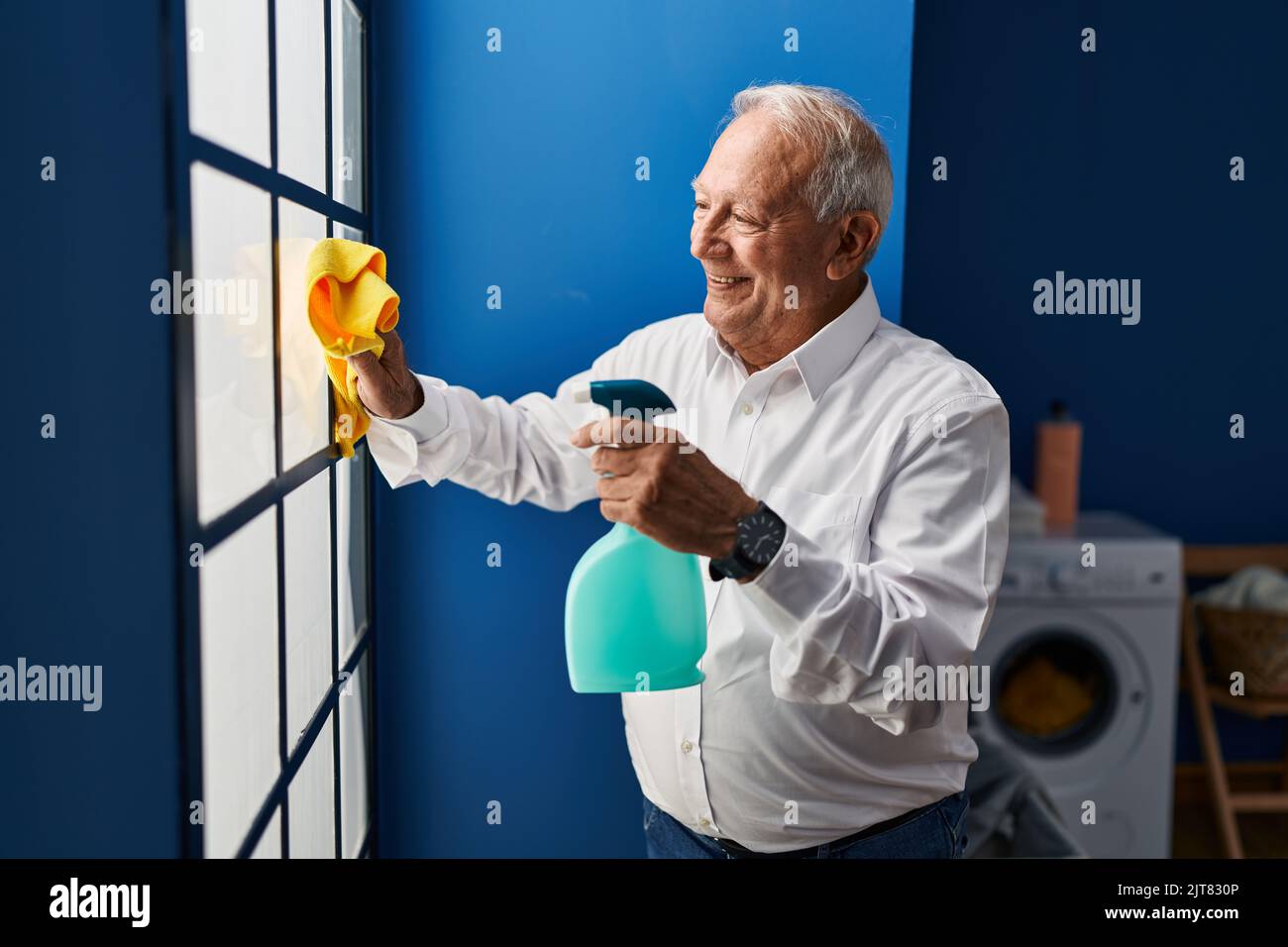 Happy man cleaning window hi-res stock photography and images - Alamy