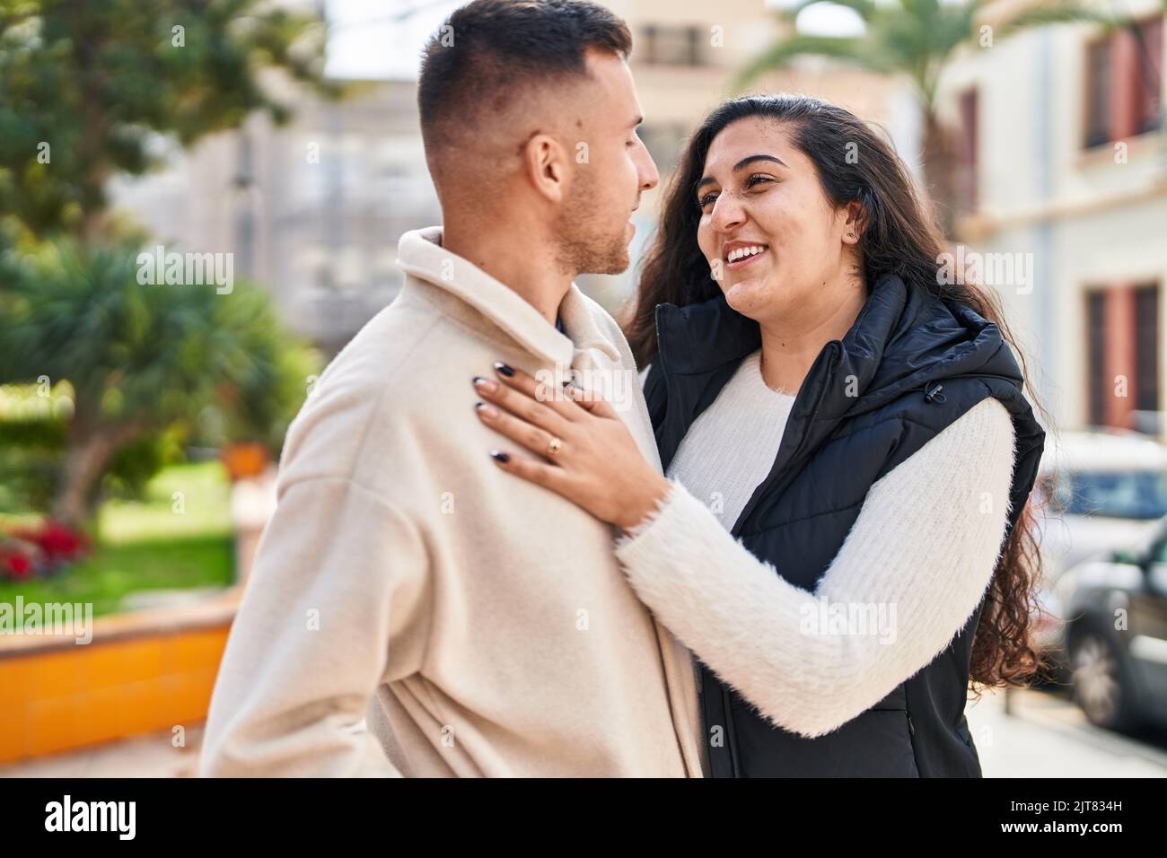 Man and woman couple hugging each other standing at park Stock Photo ...
