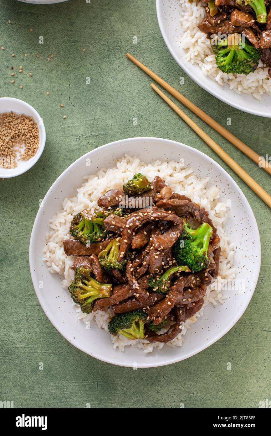 Beef and broccoli stir fry served over rice Stock Photo