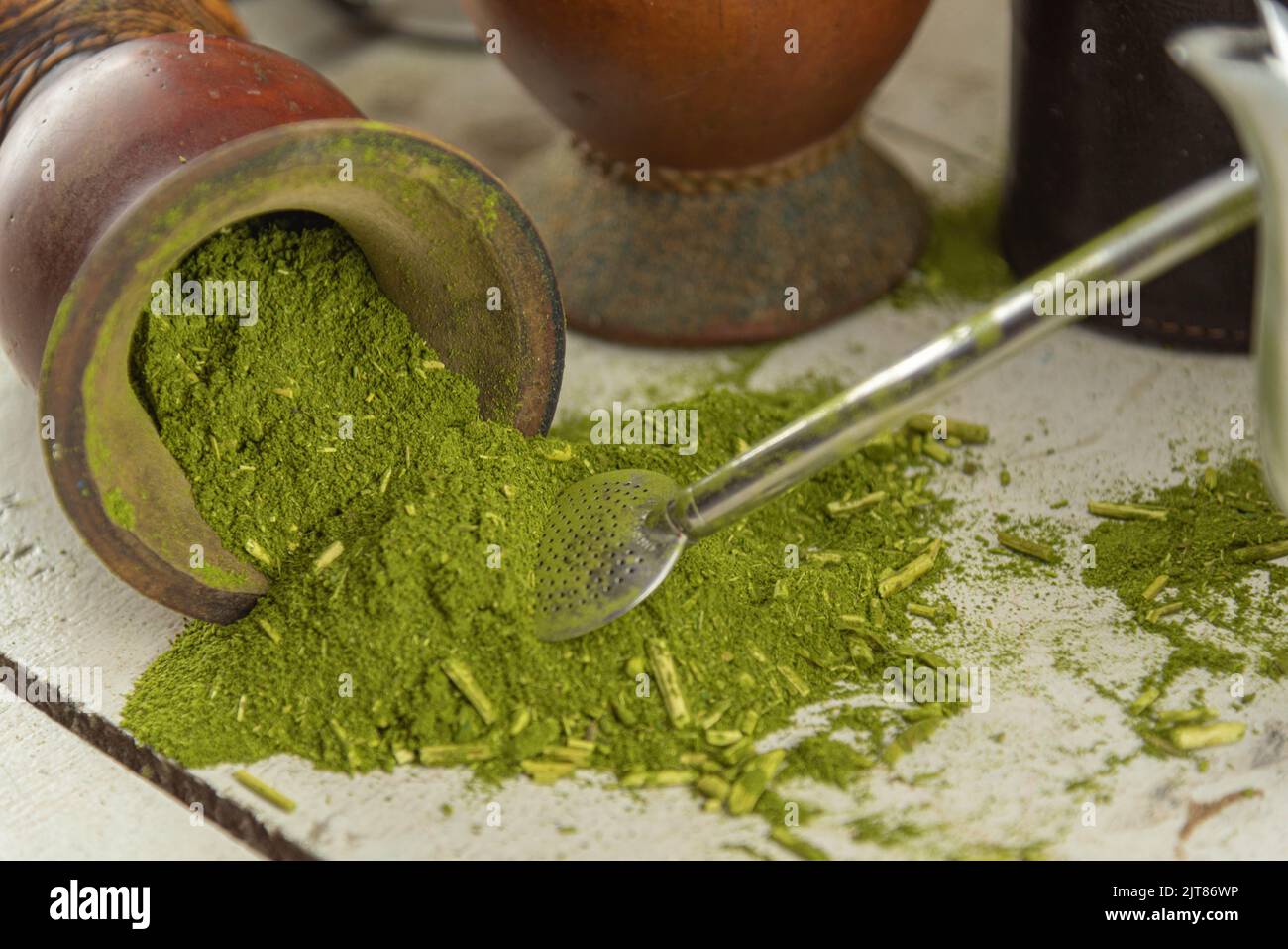 Mate herb (Ilex paraguariensis) and utensils for preparing mate tea
