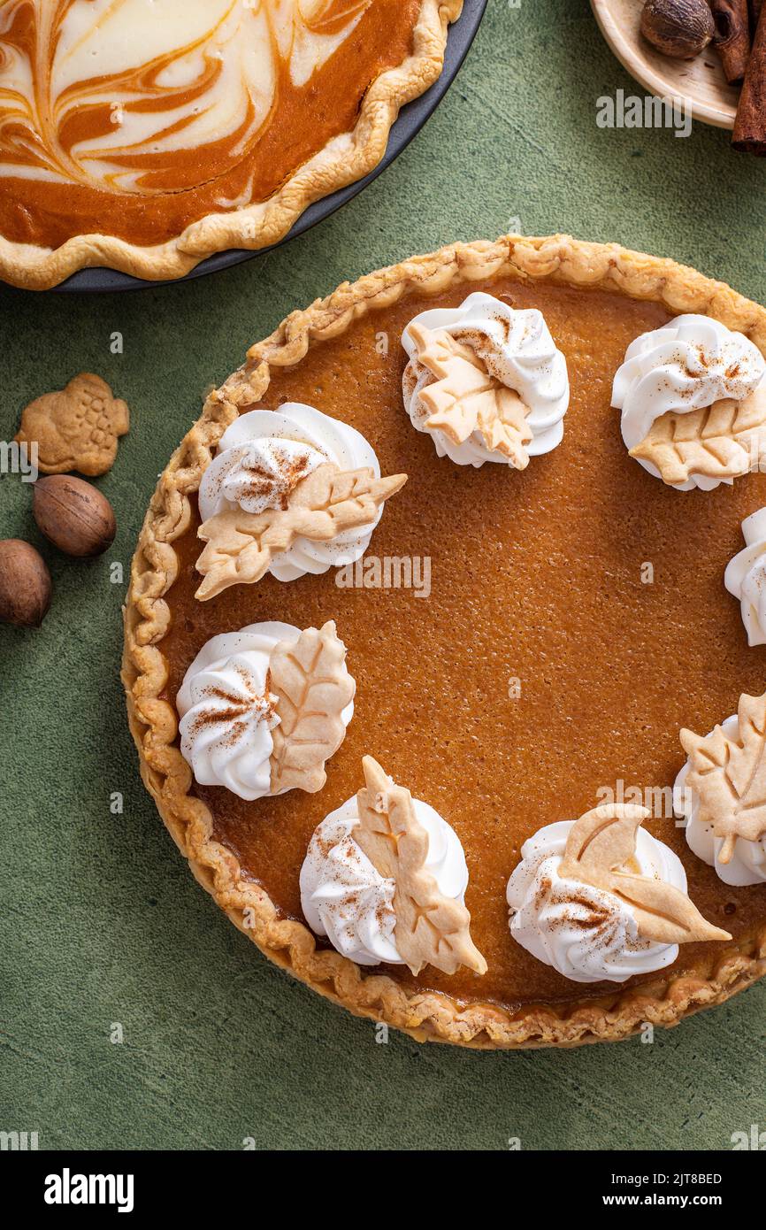 Traditional Thanksgiving pumpkin pie with flaky crust Stock Photo