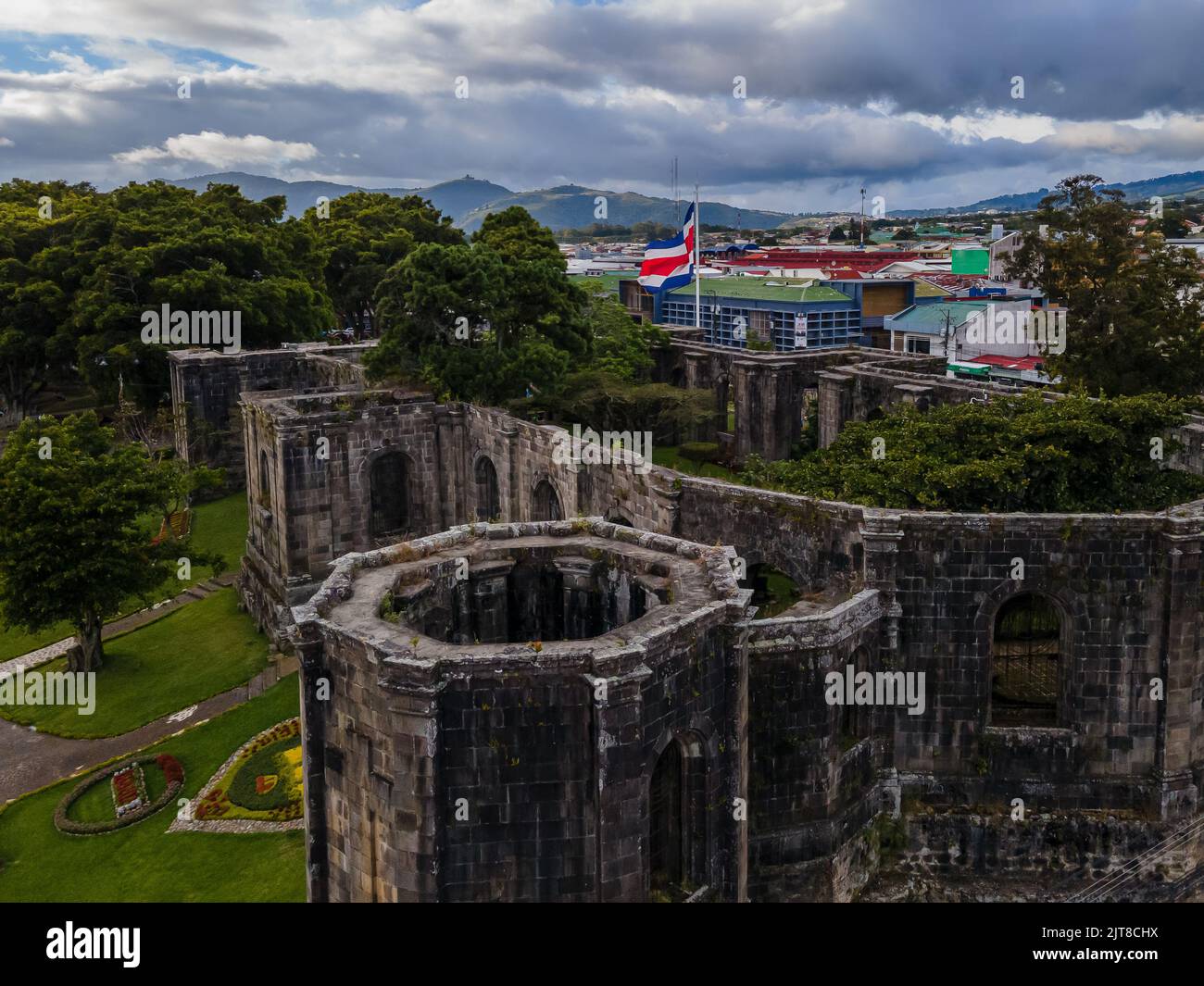 Beautiful aerial cinematic footage of the ruins, the CostaRican Flag, and the Bicentennial monument in Cartago Center  in Costa Rica Stock Photo