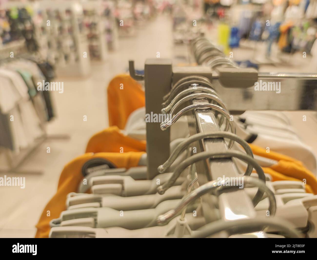 Coat racks in a department store. Clothing sale store material