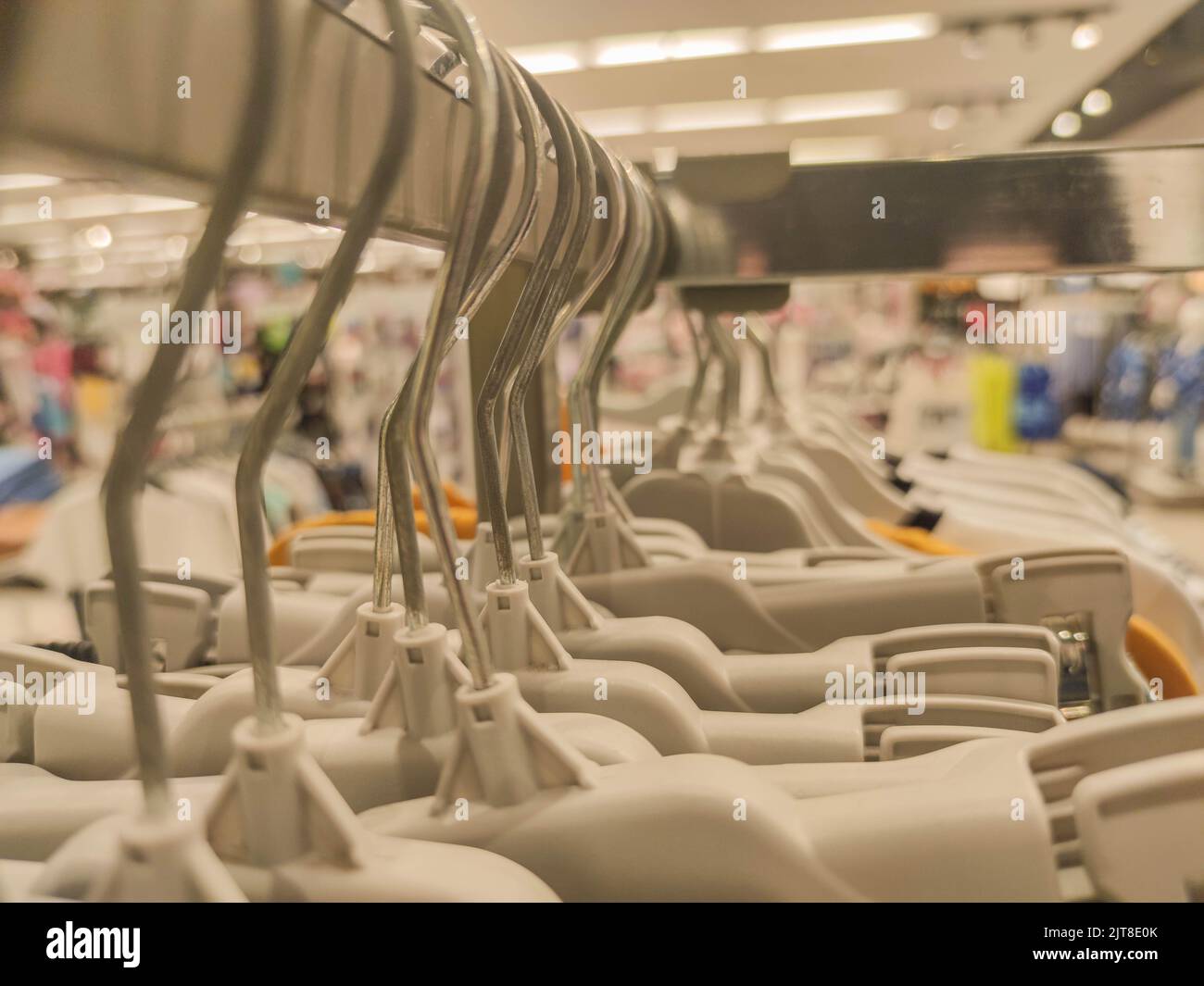 Coat racks in a department store. Clothing sale store material