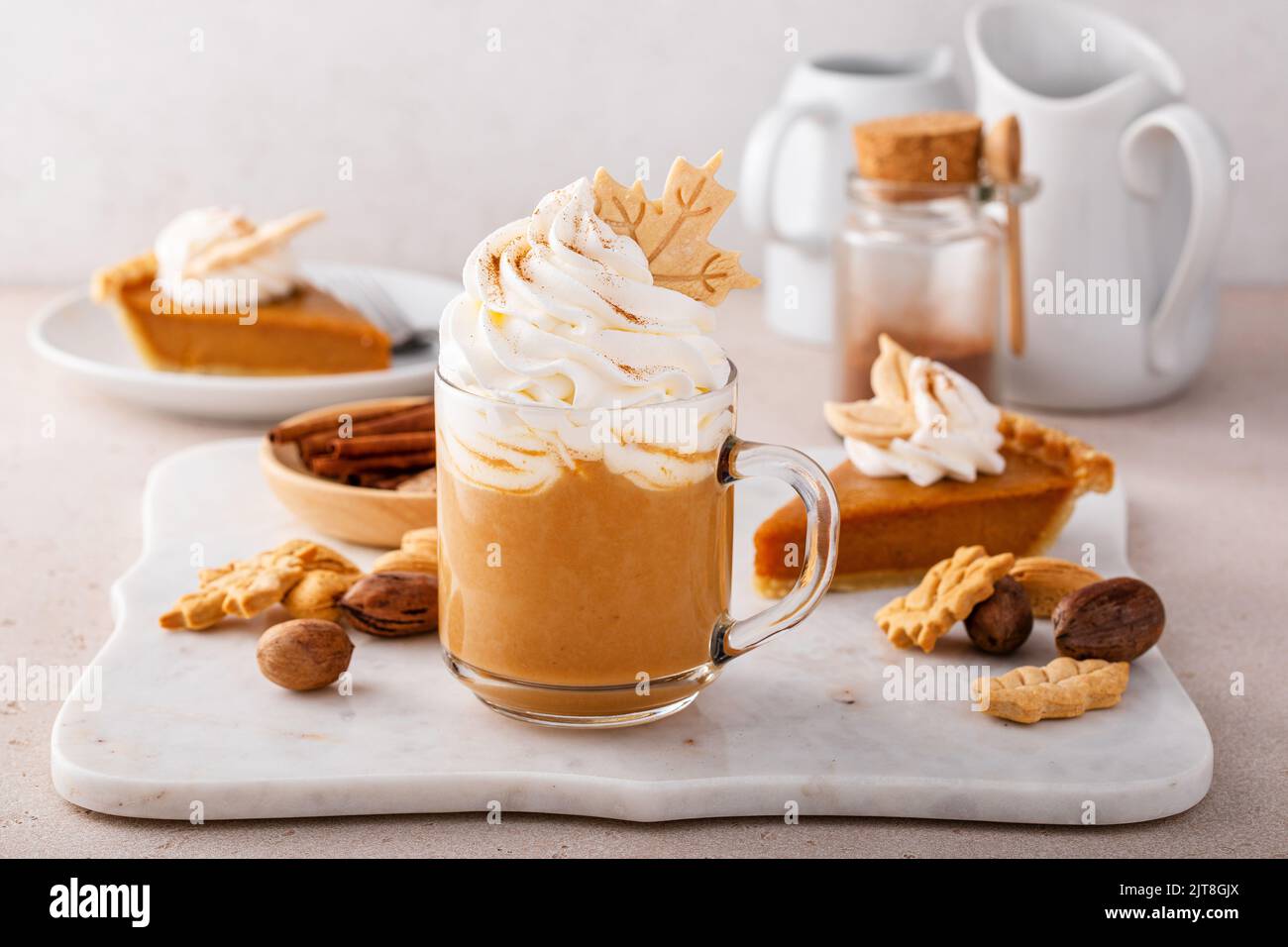 Pumpkin spice latte topped with whipped cream and dusted with cinnamon ...