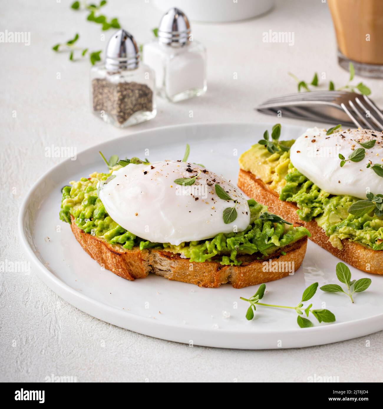 Avocado toast with a poached egg on top Stock Photo