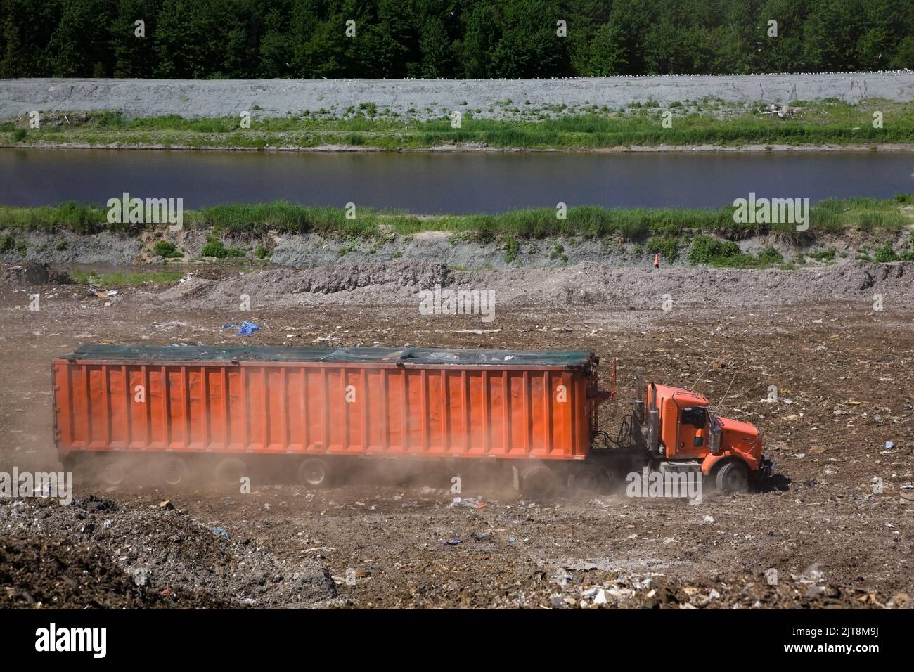 Transportation truck at waste management site. Stock Photo