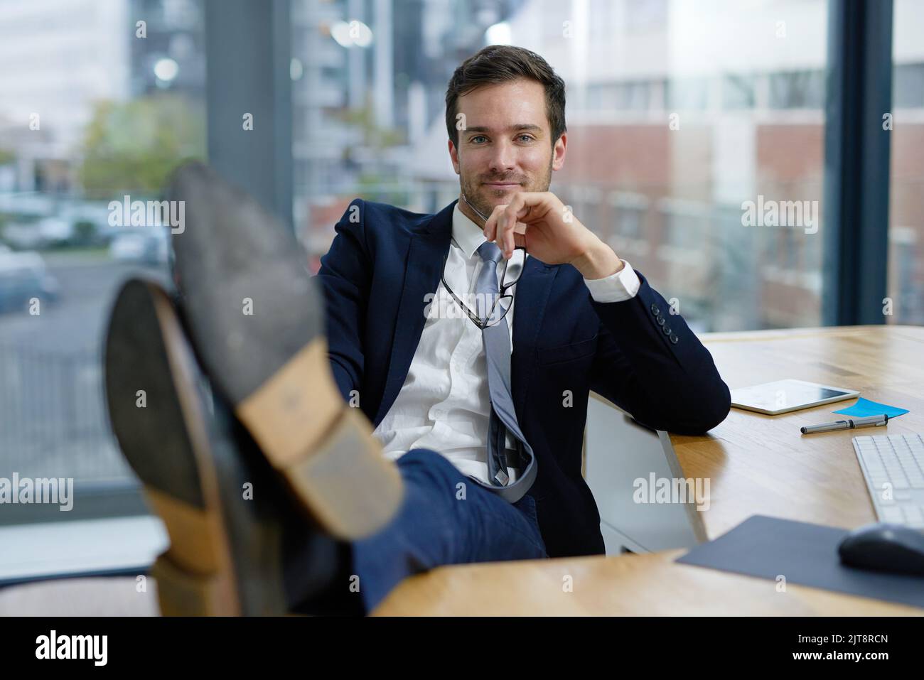 Man sitting desk feet up hi-res stock photography and images - Alamy