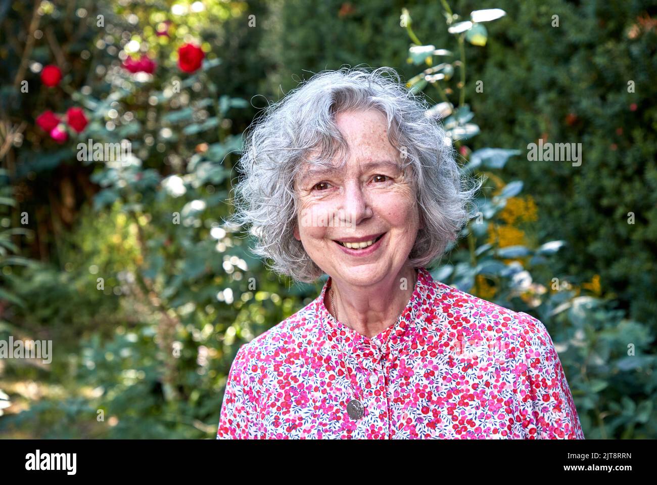 Hamburg, Germany. 24th Aug, 2022. Ulla Hahn, writer, stands in her garden after an interview about her new novel "Days in Vitopia". The book will be published Aug. 31, 2022, by Penguin in Munich. (to dpa "Author Ulla Hahn does not need much to live") Credit: Georg Wendt/dpa/Alamy Live News Stock Photo