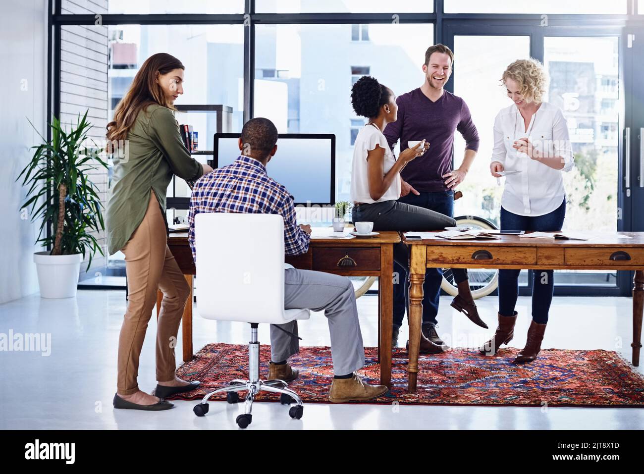 The creative workplace is an easygoing but productive space. a team of designers working together in the office. Stock Photo