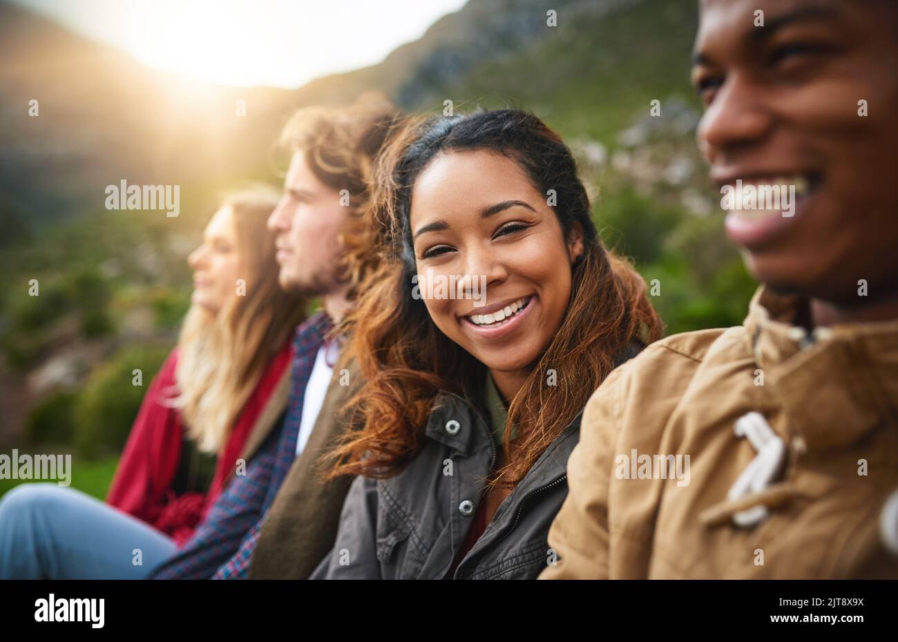I love my tribe. Portrait of a happy young woman hanging out with her friends outside. Stock Photo