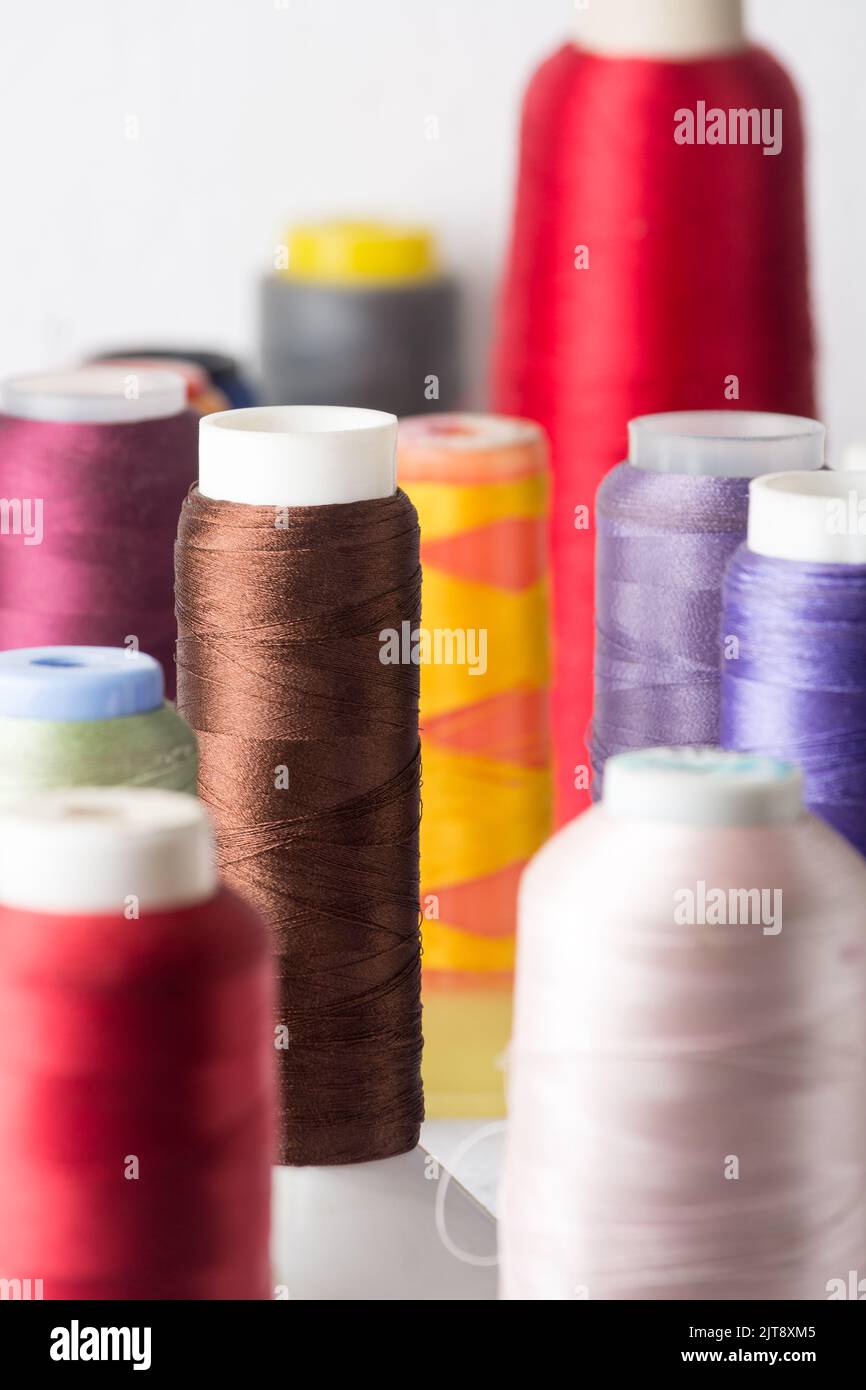 closeup of spool of sewing threads used in fabric and textile industry