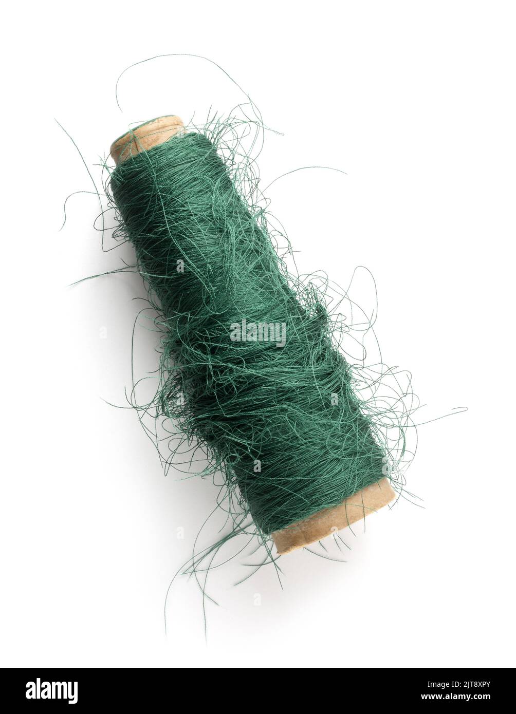 tangled spool of sewing thread, isolated on white background, taken