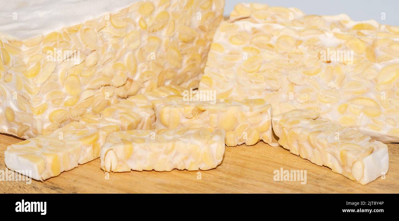 Raw slices of Tempeh, typical Indonesian food fermented made from fermented soybeans. Tempeh is