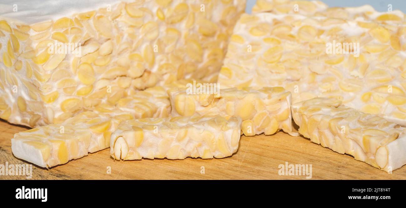 Raw slices of Tempeh, typical Indonesian food fermented made from fermented soybeans. Tempeh is
