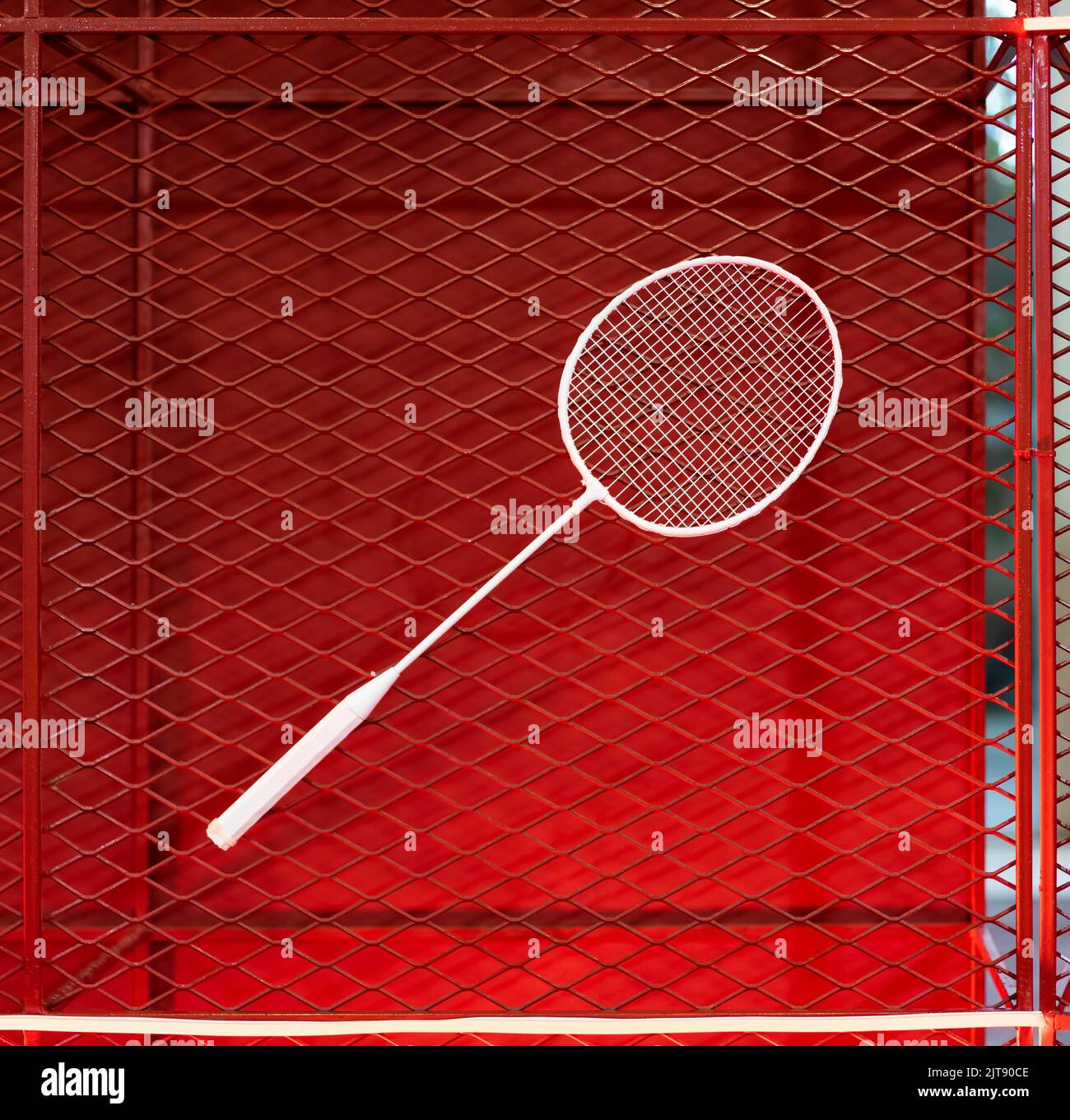 manual stringing of a badminton racket in service Stock Photo - Alamy
