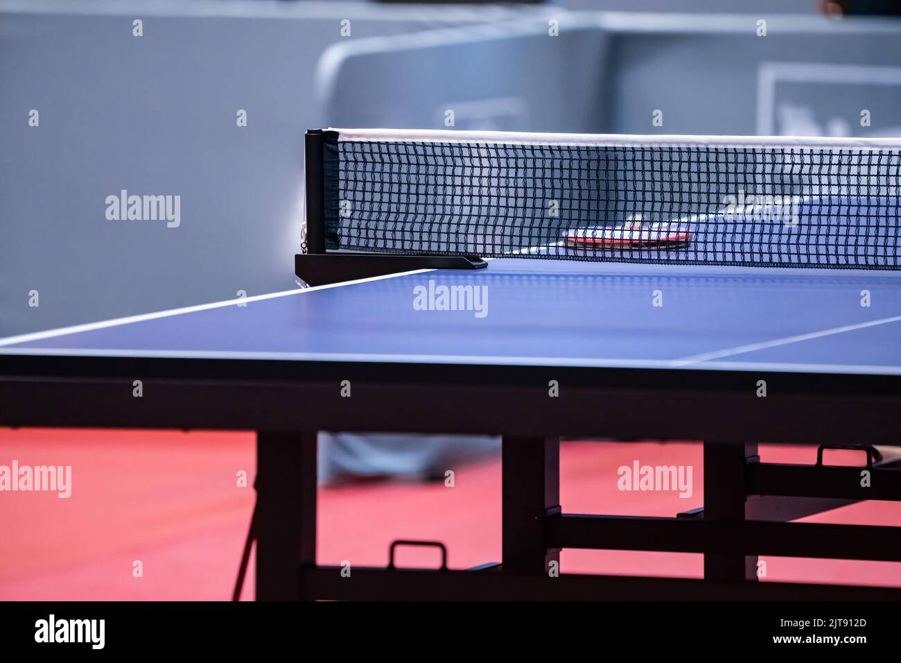 Blue and smooth surface table tennis table with tight black net to