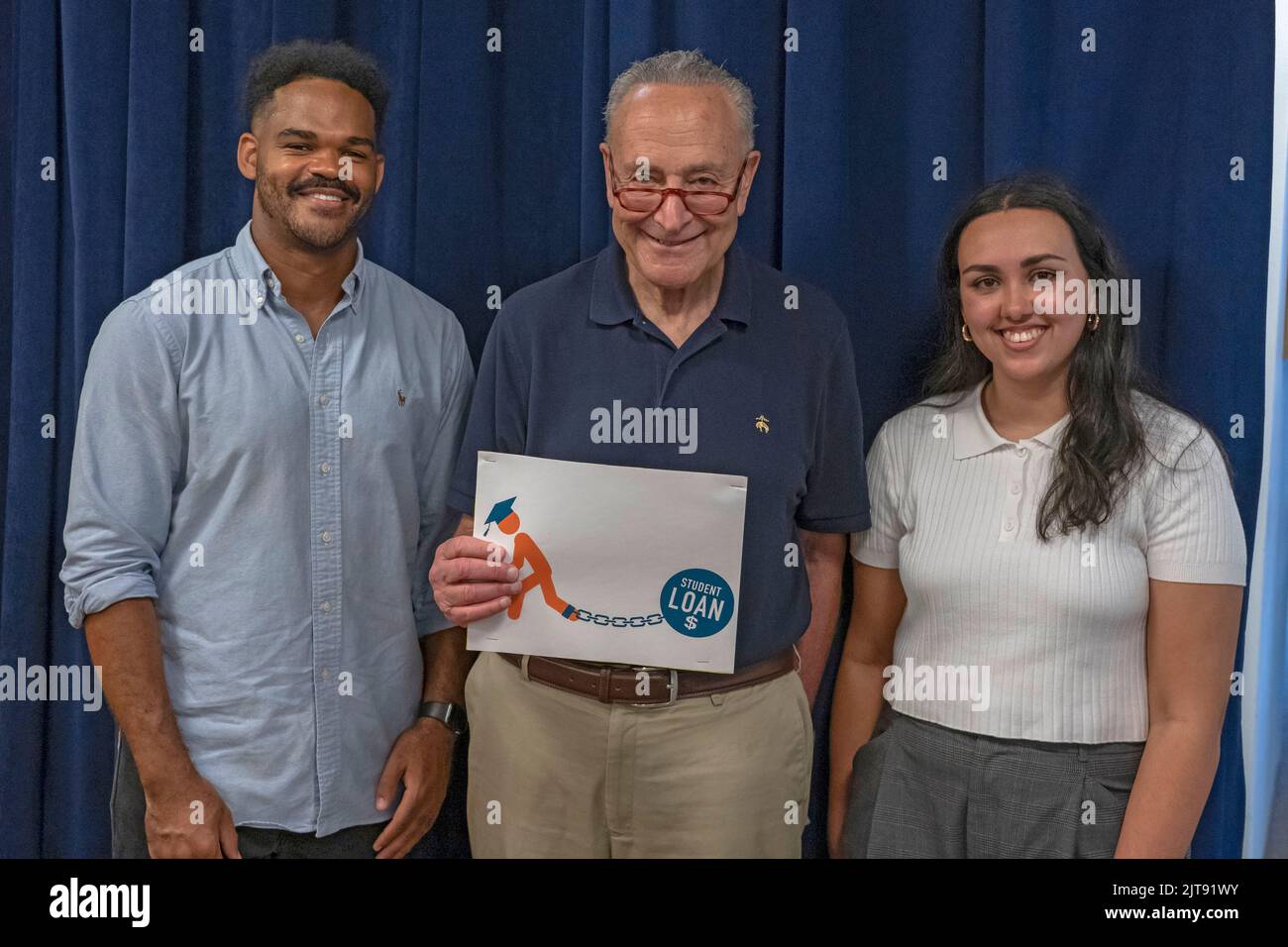 Senate Majority Leader, Chuck Schumer (C), poses With Darrell Holman (L) and Sabrina Calazans (R) in New York City. Senator Schumer called Sunday for loan service companies to 'staff up' in response to President Joe Biden's student debt forgiveness plan announced last week. The Senate majority leader celebrated the announced relief program on Aug. 28, for which Schumer noted that New York borrows would see a combined $16.3 billion in cancelled debt thanks to what he cites as a historic move and one he has long championed. Stock Photo