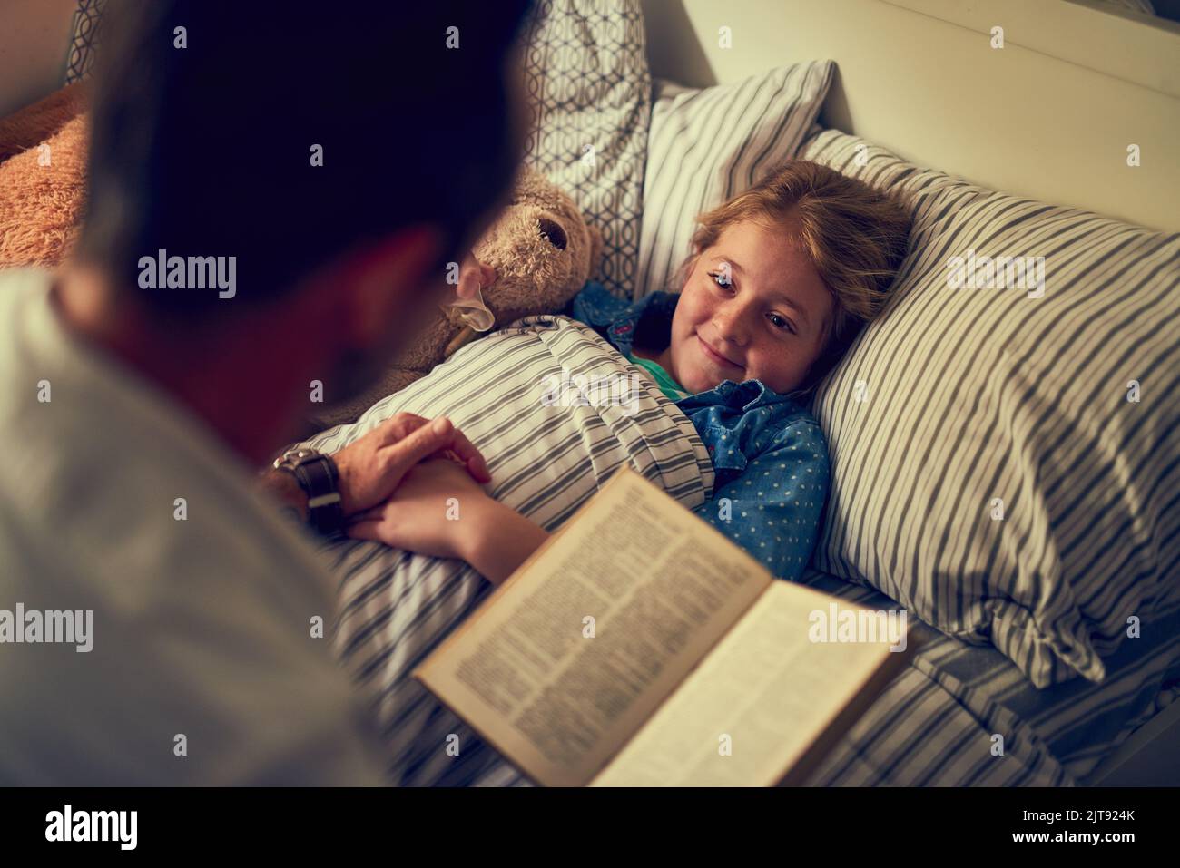 Shell be having some magical dreams tonight. a father reading a bedtime ...