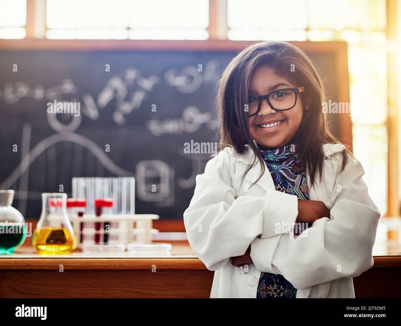 Allow them to dream big. a cute little girl in a science lab Stock