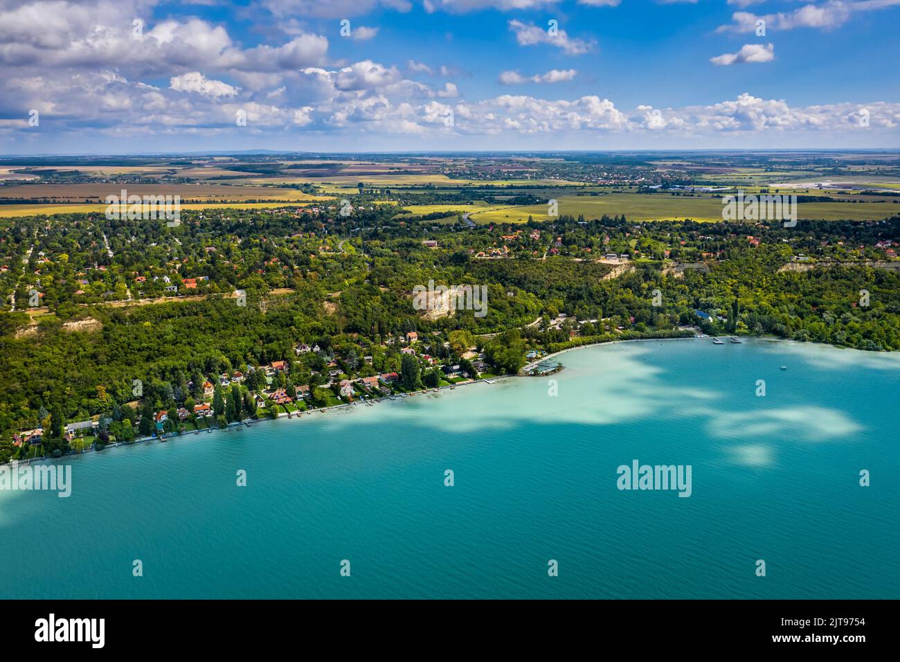 Balatonakarattya, Hungary - Aerial panoramic view of Balatonakarattya on a sunny summer day with turquoise Lake Balaton, blue sky and clouds Stock Photo
